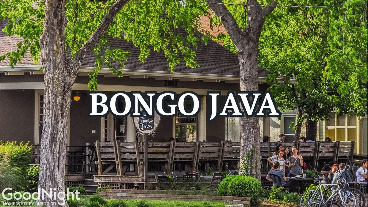 This image captures the exterior of Bongo Java with its lively outdoor seating area and signage. People are seen socializing and enjoying coffee under sunny skies, establishing a sense of neighborhood vibrancy and convenience. The café’s inviting facade and central location make it a natural hub for both locals and travelers.